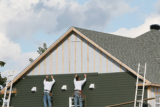 Professional Siding Contractor technician working in Hydes, MD